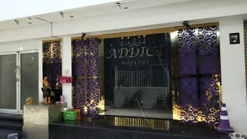 Addict Massage: shopfront with the logo