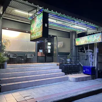 Aurora Massage33: shopfront at night
