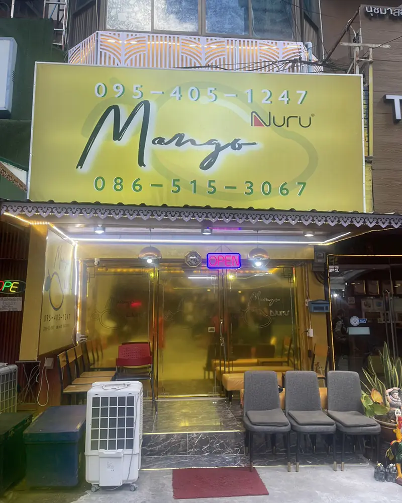Mango Massage: mango Nuru shopfront with yellow sign and phone number