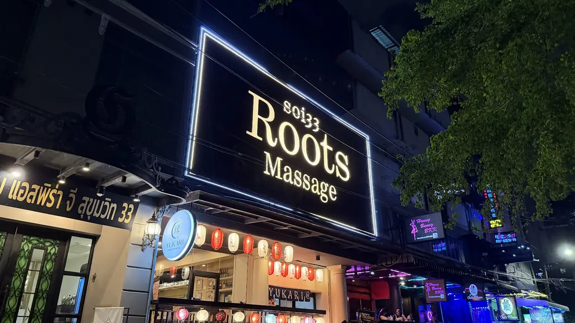 Soi 33 Roots Massage: lit sign at night