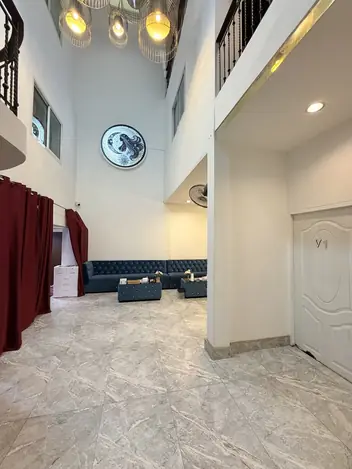 Stella Nuru Massage BKK: lobby with sofas and a high ceiling