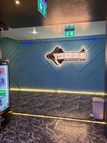 THE333 Nuru Massage: lobby with the logo wall