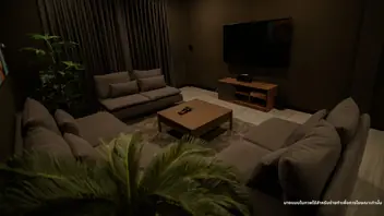 XO Spa: dark lounge with sofas and wall TV